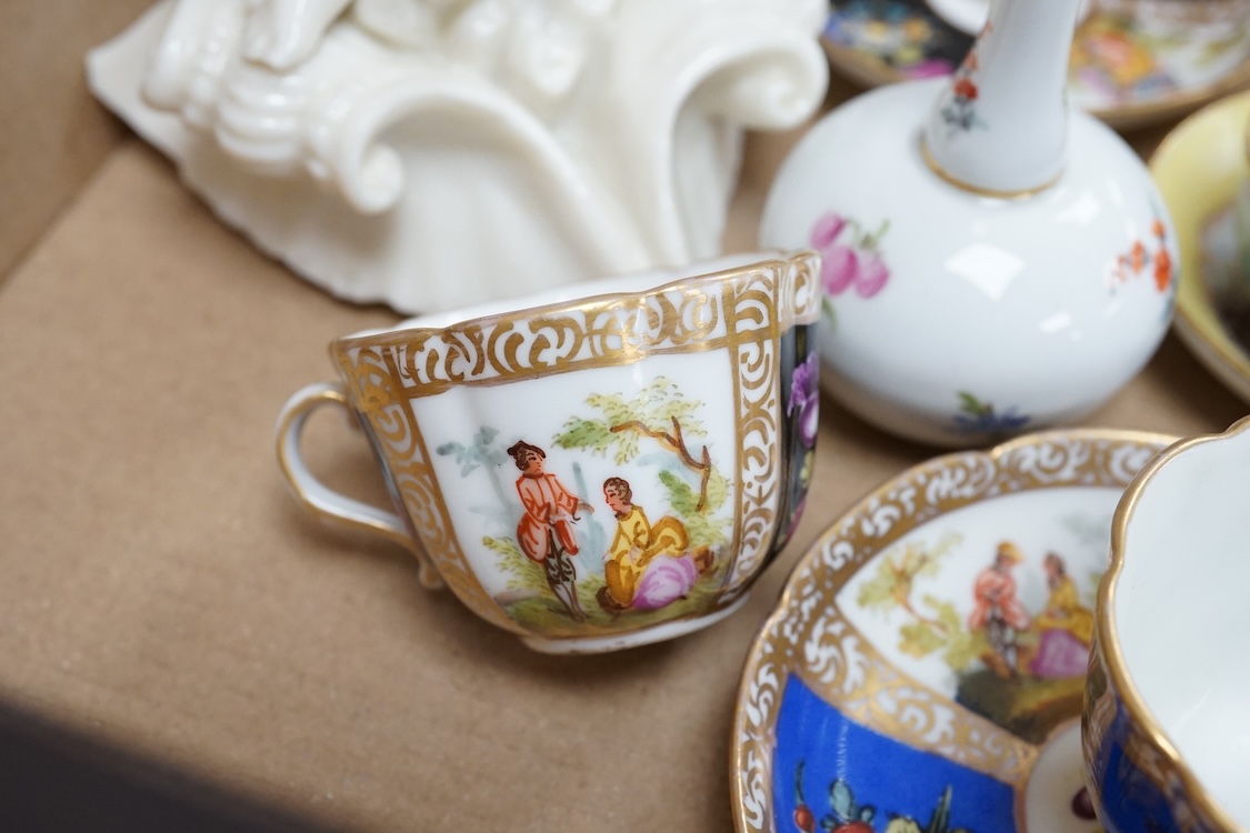 A group of 19th/20th century German porcelain, comprising a Nymphenburg pug, seven Dresden miniature cups and saucers and a Meissen bottle, largest 13cm high
